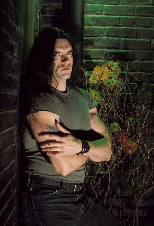 Peter Steele dark moody portrait leaning against a brick wall